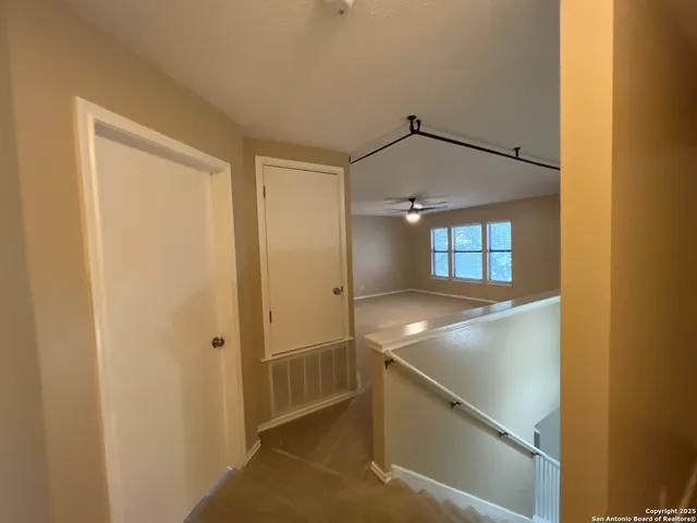a bathroom with a toilet and a bath tub