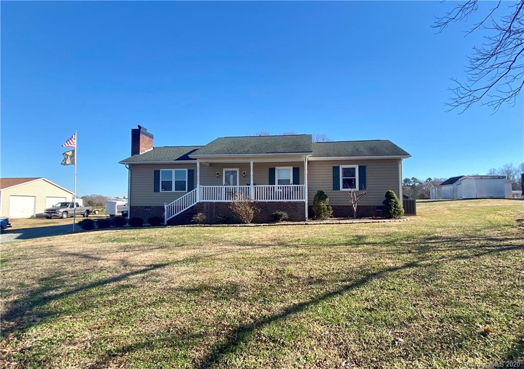 228 Huffstetler Lake Road Dallas, NC 28034 - Photo 1 of 27 a front view of a house with a yard