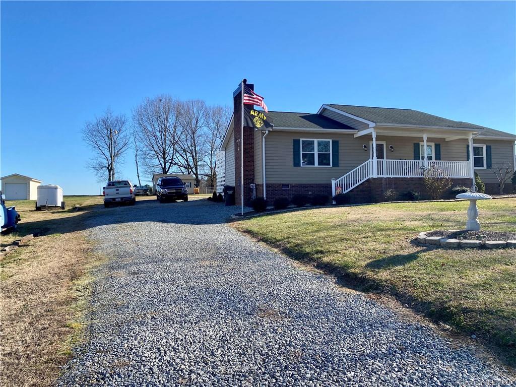 228 Huffstetler Lake Road Dallas, NC 28034 - Photo 2 of 27 a view of a house with a yard