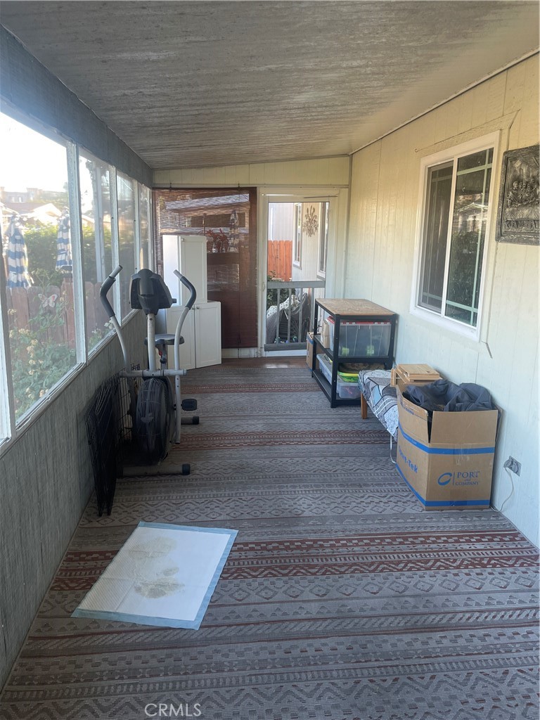 300 North Rampart Street, Unit 157 Orange, CA 92868 - Photo 5 of 14 a living room with furniture and a large window