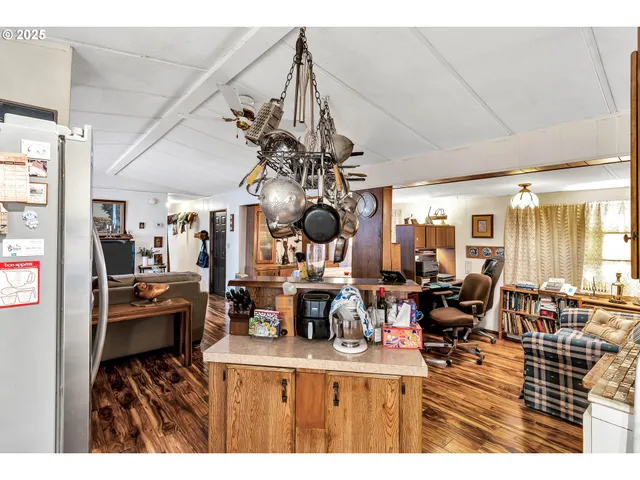 a living room with fireplace furniture and a flat screen tv