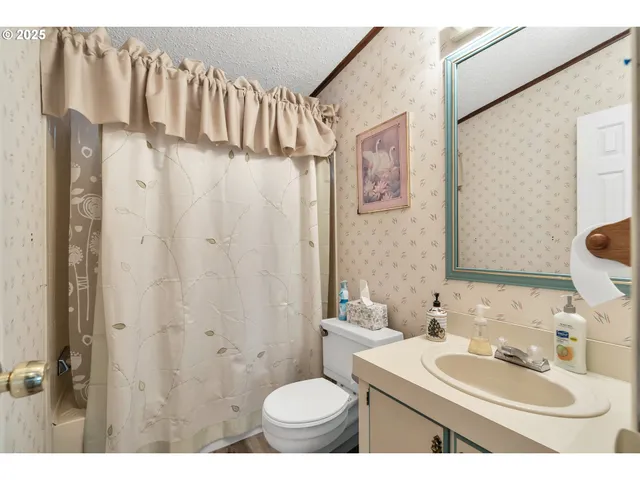 a living room with furniture and flowers