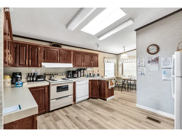 a bathroom with a sink mirror vanity and toilet
