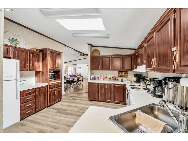 a view of a dining room with furniture and a book shelf