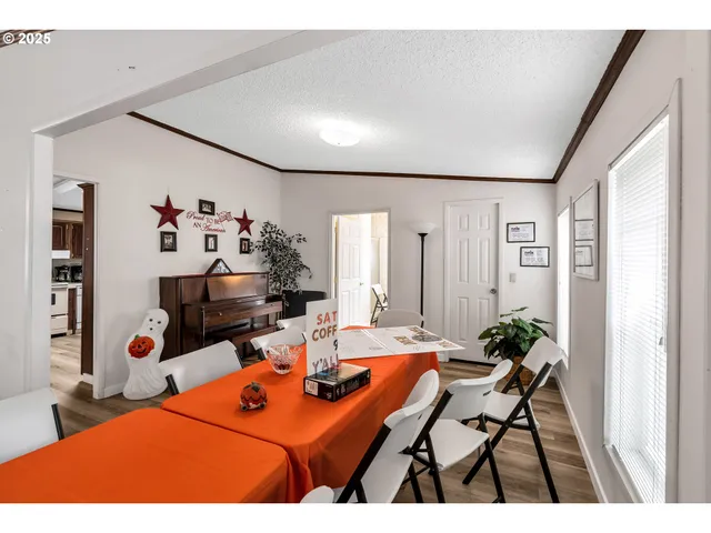 a view of a house with wooden fence