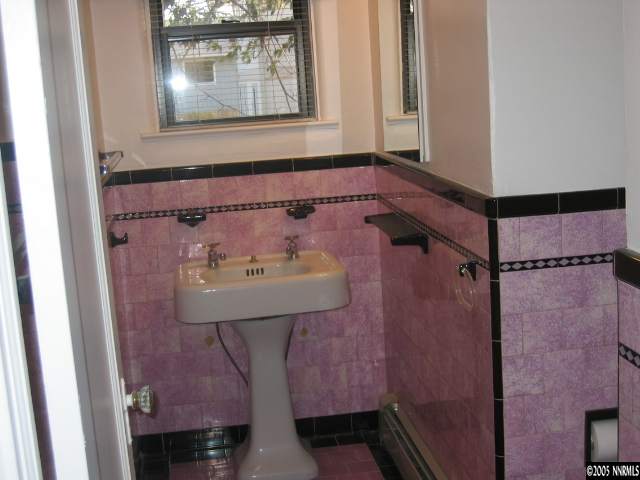 953 Bell Street Reno, NV 89503 - Photo 3 of 9 a bathroom with a sink and a mirror
