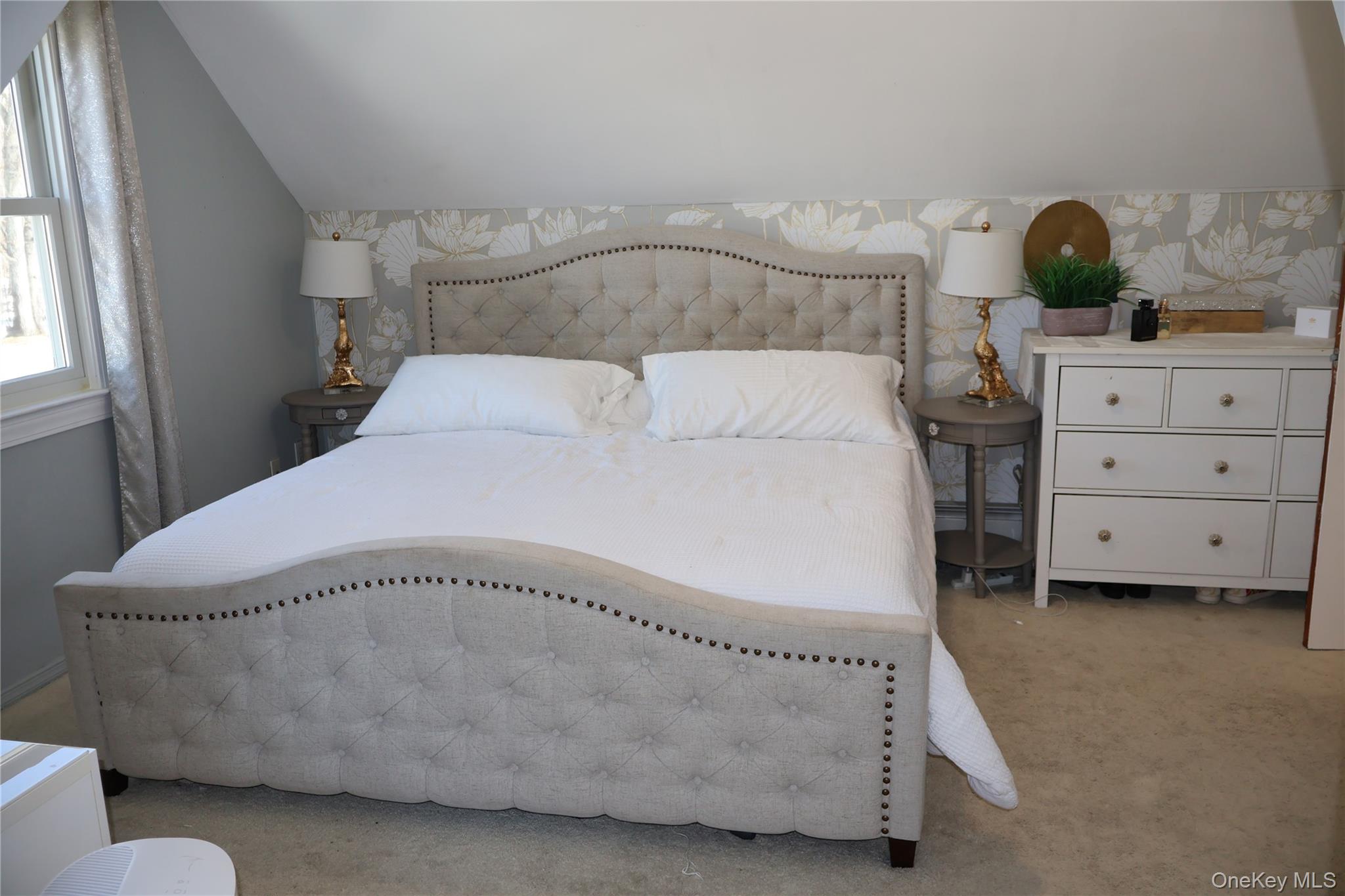 117 North Coleman Road Centereach, NY 11720 - Photo 13 of 29 a large bed sitting in a bedroom next to a window