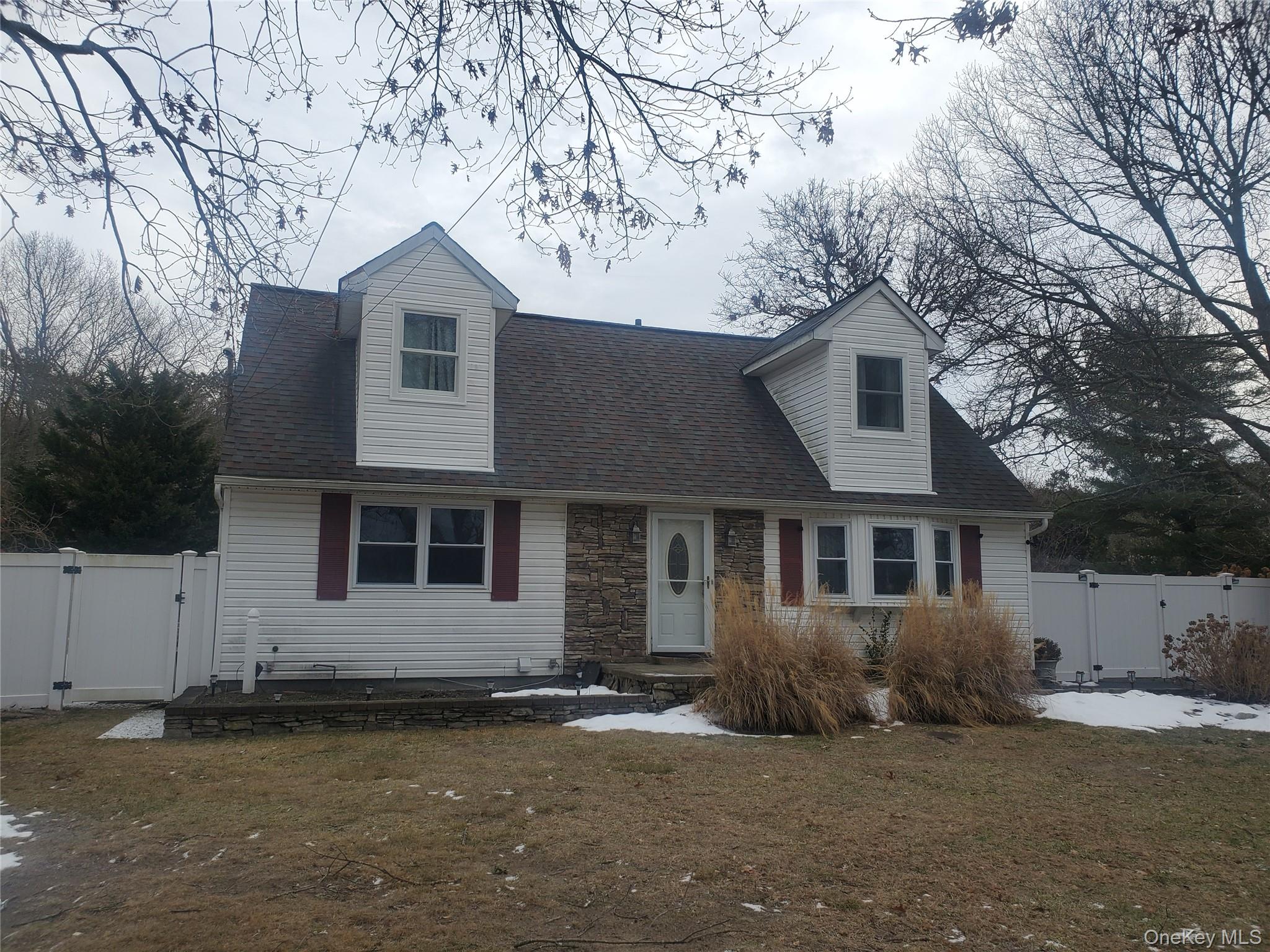 117 North Coleman Road Centereach, NY 11720 - Photo 2 of 26 New england style home with a gate and roof with shingles