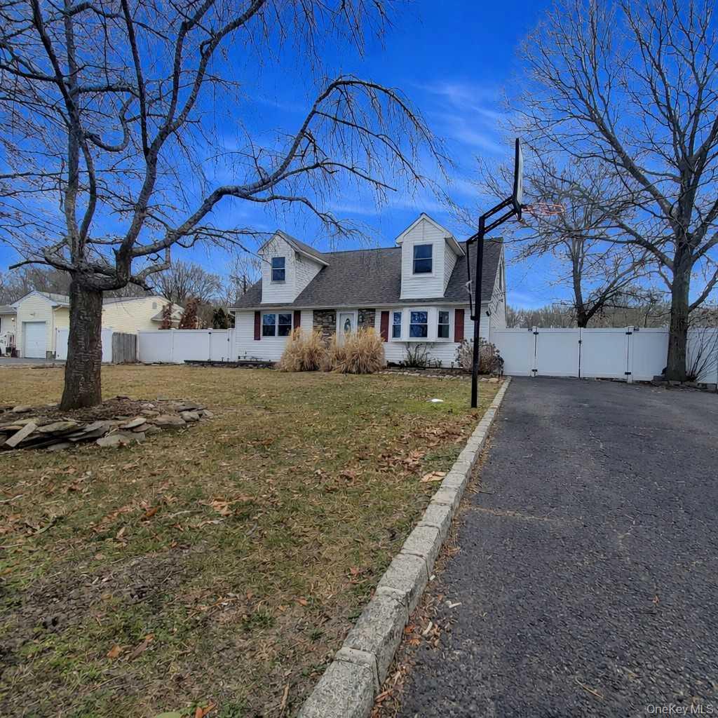 117 North Coleman Road Centereach, NY 11720 - Photo 22 of 29 a view of a house with a yard
