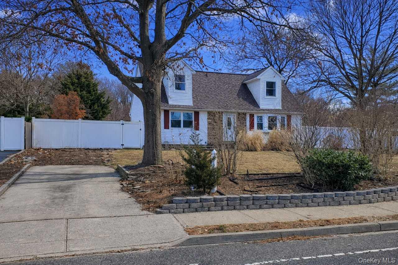 117 North Coleman Road Centereach, NY 11720 - Photo 23 of 29 a front view of a house with garden