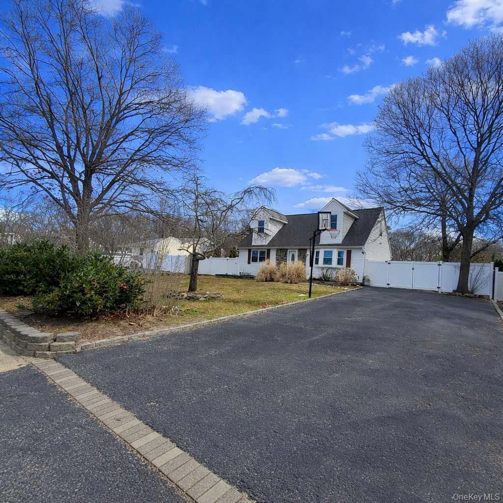 117 North Coleman Road Centereach, NY 11720 - Photo 25 of 29 a view of a house with a yard