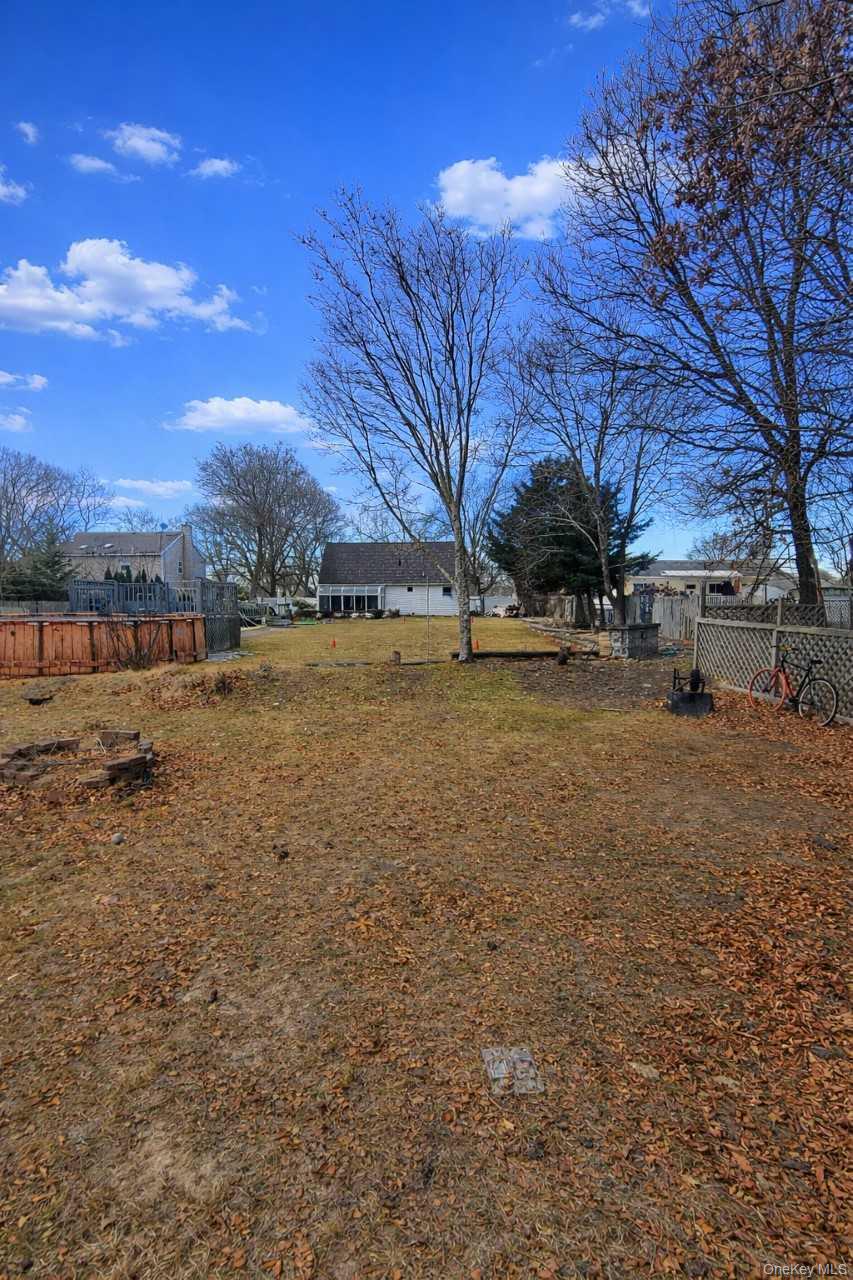 117 North Coleman Road Centereach, NY 11720 - Photo 26 of 29 a view of a yard with a house