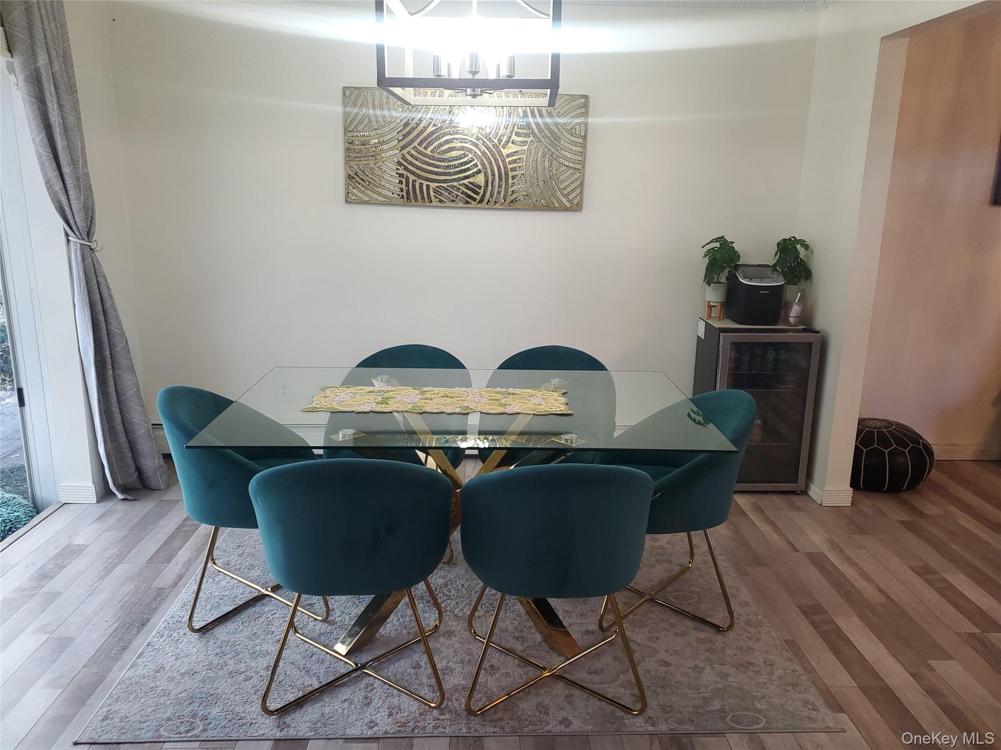 117 North Coleman Road Centereach, NY 11720 - Photo 6 of 29 a view of a dining room with furniture and wooden floor