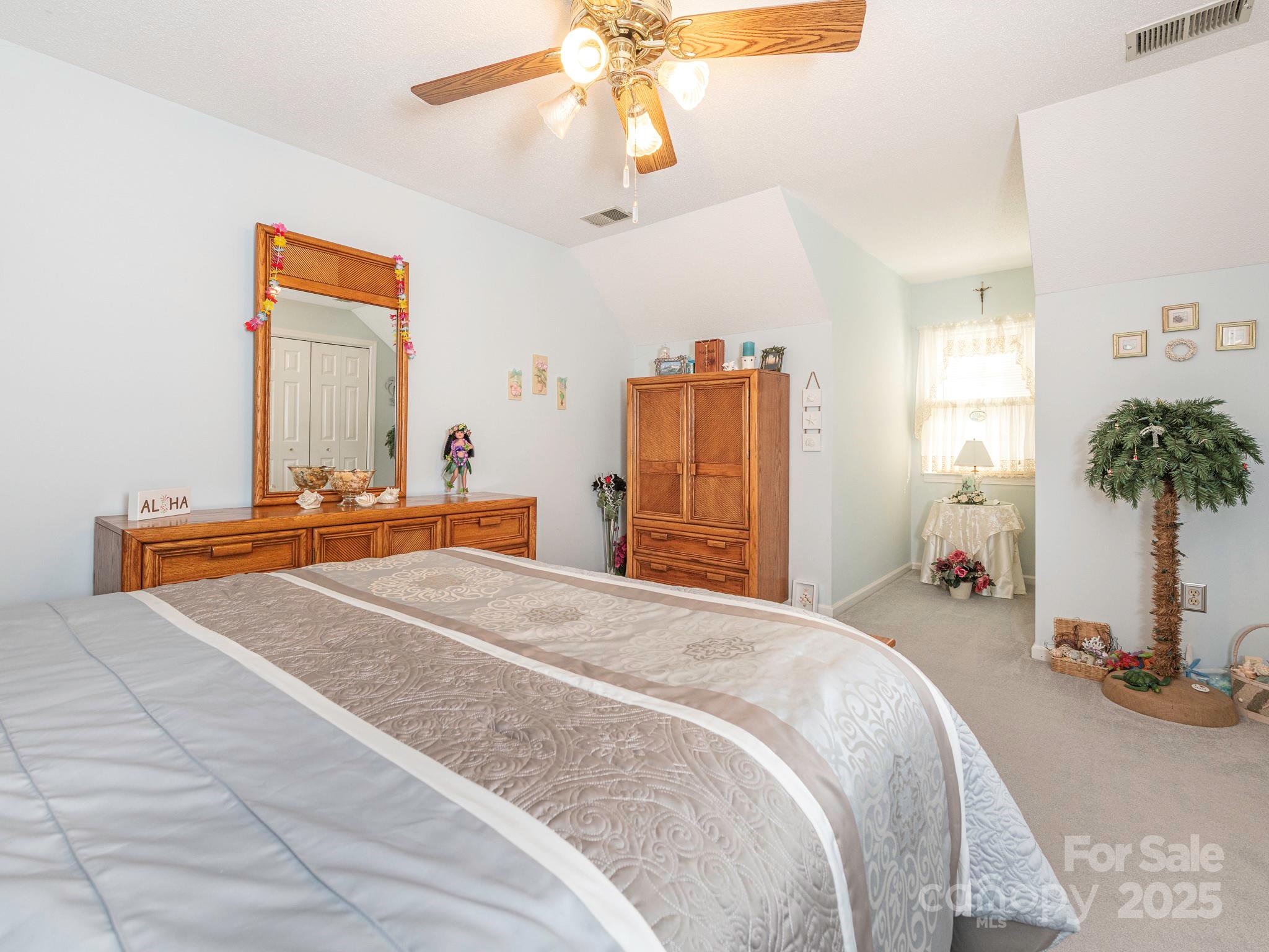 1800 Lake Lynn Road Concord, NC 28025 - Photo 13 of 45 a bedroom with a bed and a chandelier