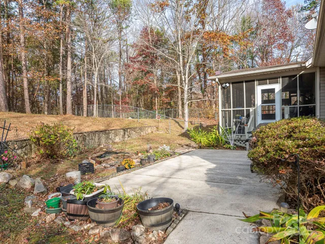 a front view of a house with a yard and seating area
