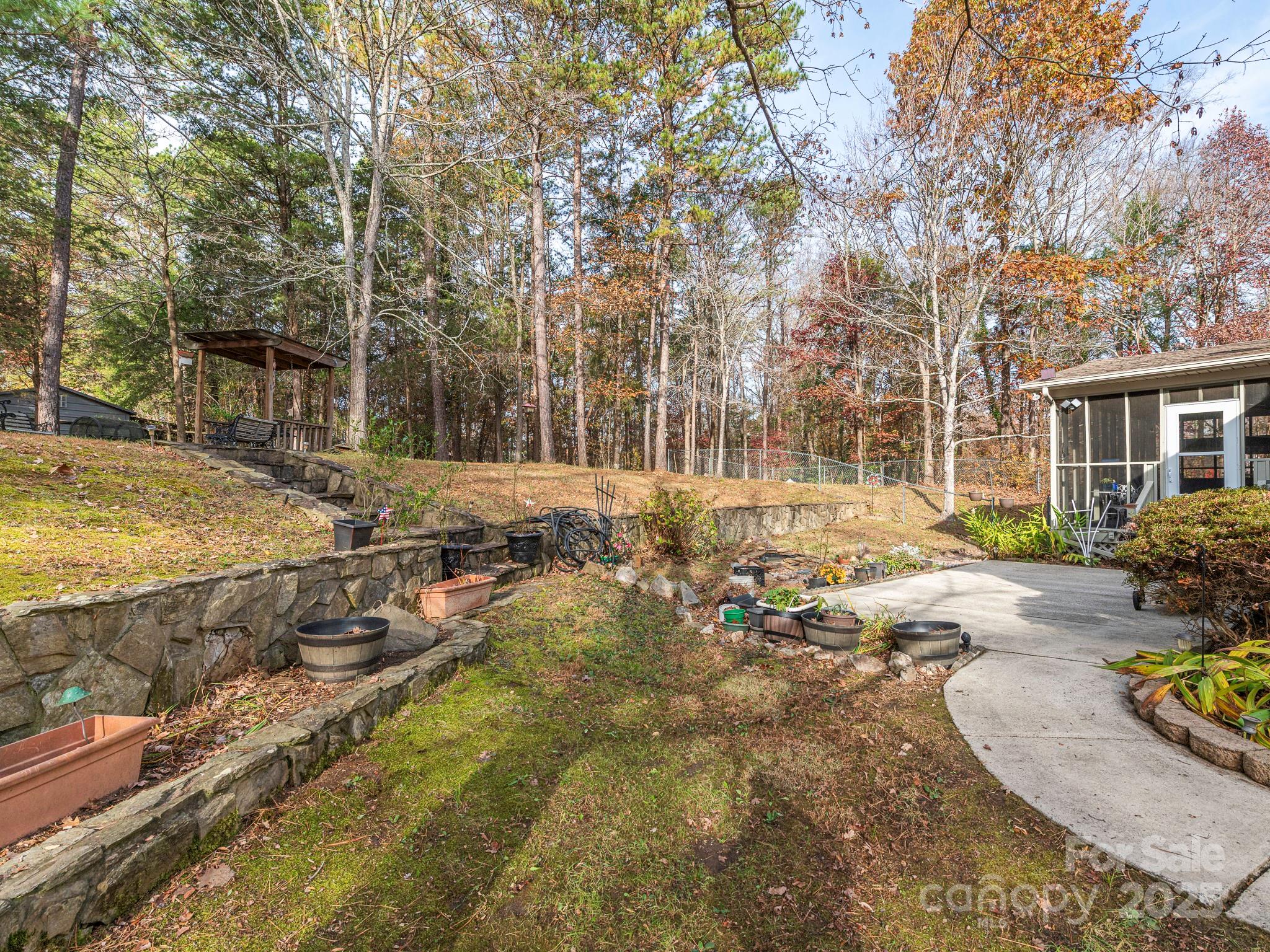1800 Lake Lynn Road Concord, NC 28025 - Photo 19 of 45 a view of a swimming pool with some sitting area