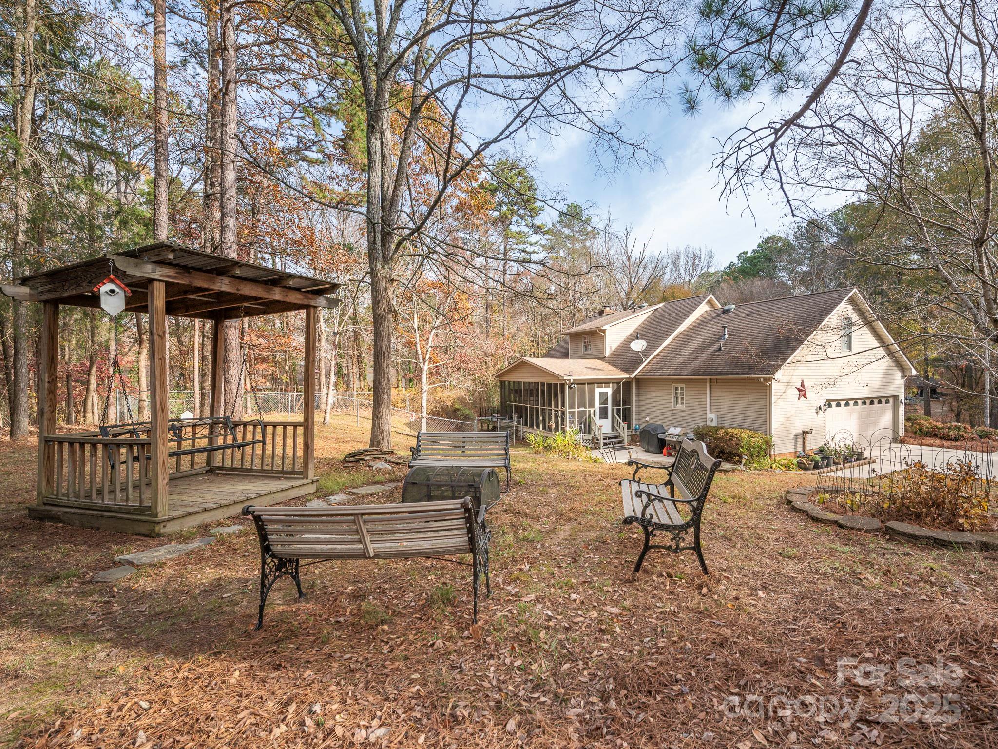 1800 Lake Lynn Road Concord, NC 28025 - Photo 20 of 45 a view of a house with a yard and sitting area