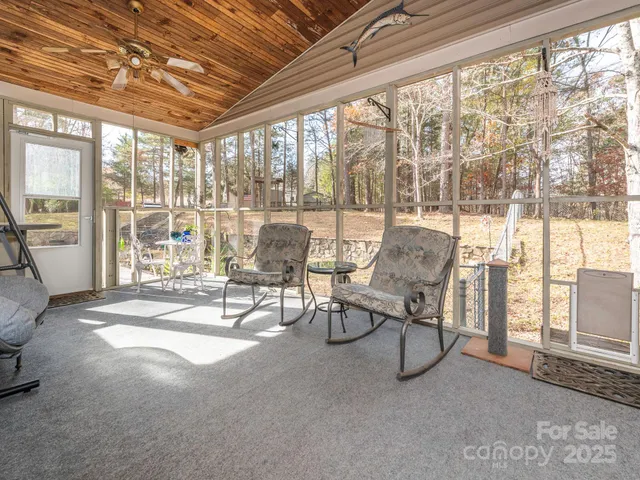 a building outdoor space with patio furniture and garden