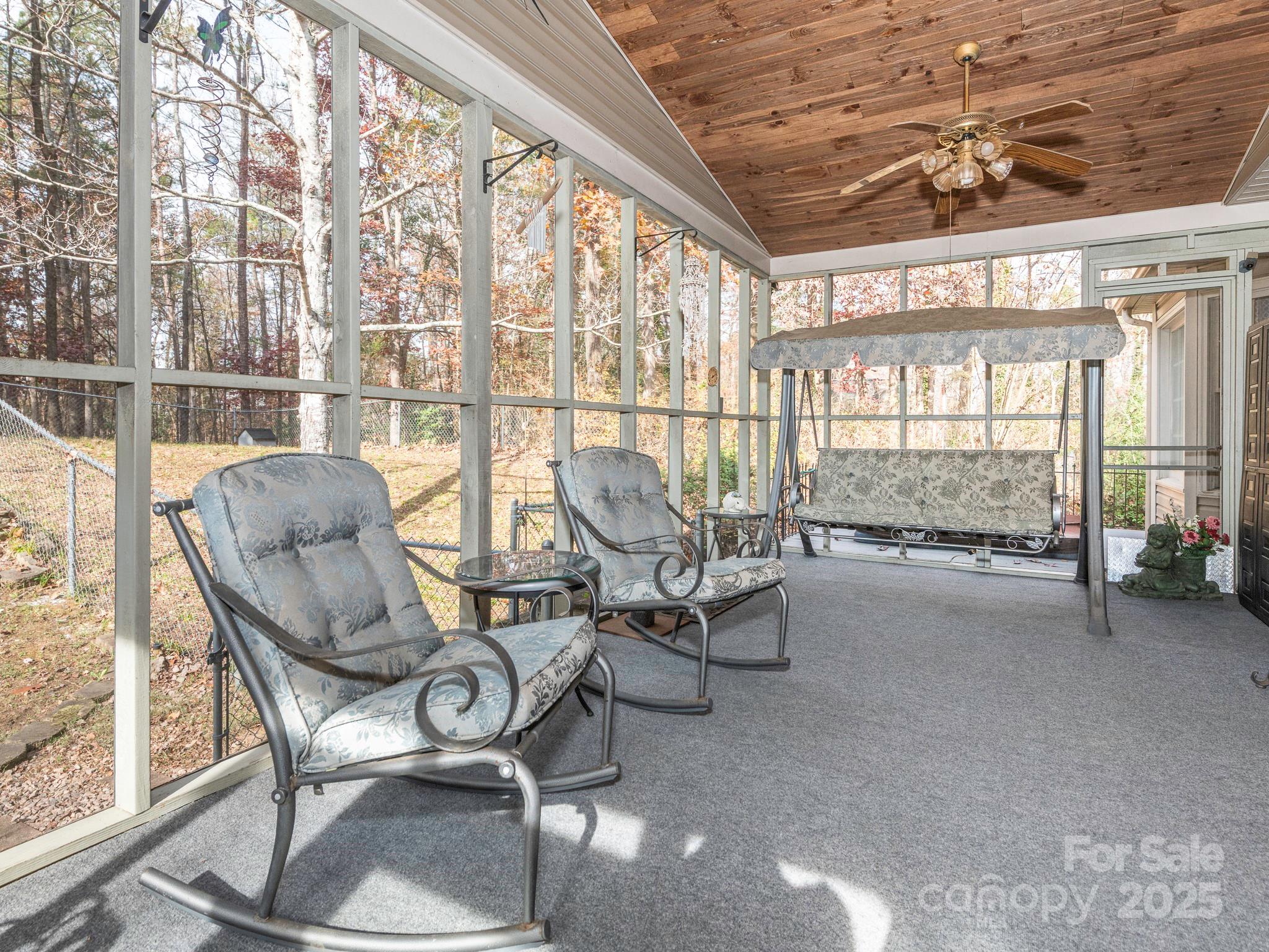 1800 Lake Lynn Road Concord, NC 28025 - Photo 34 of 45 a living room with furniture and a floor to ceiling window