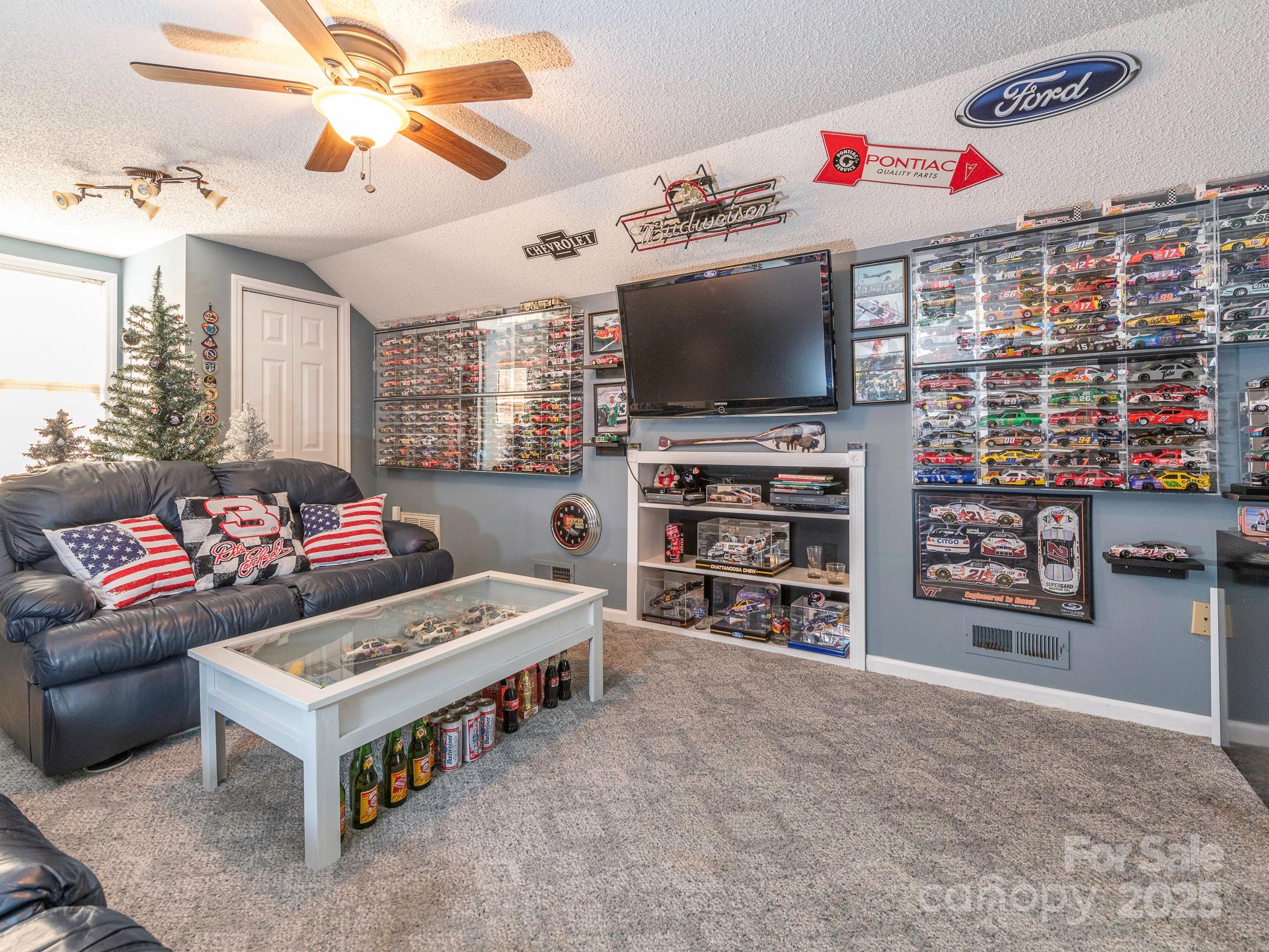 1800 Lake Lynn Road Concord, NC 28025 - Photo 35 of 45 a living room with furniture and a flat screen tv
