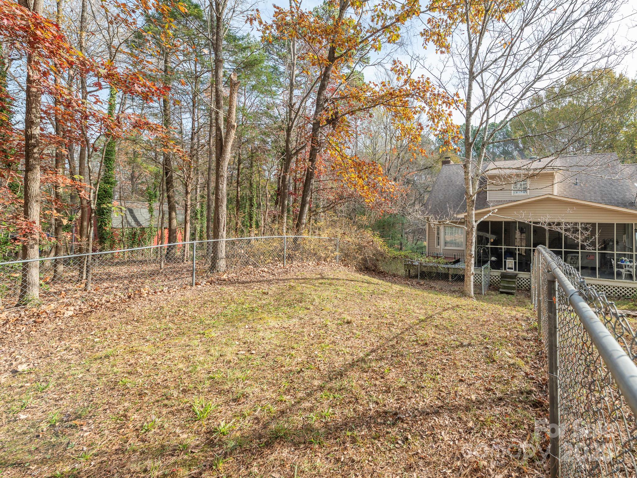 1800 Lake Lynn Road Concord, NC 28025 - Photo 39 of 45 a backyard of a house with lots of green space