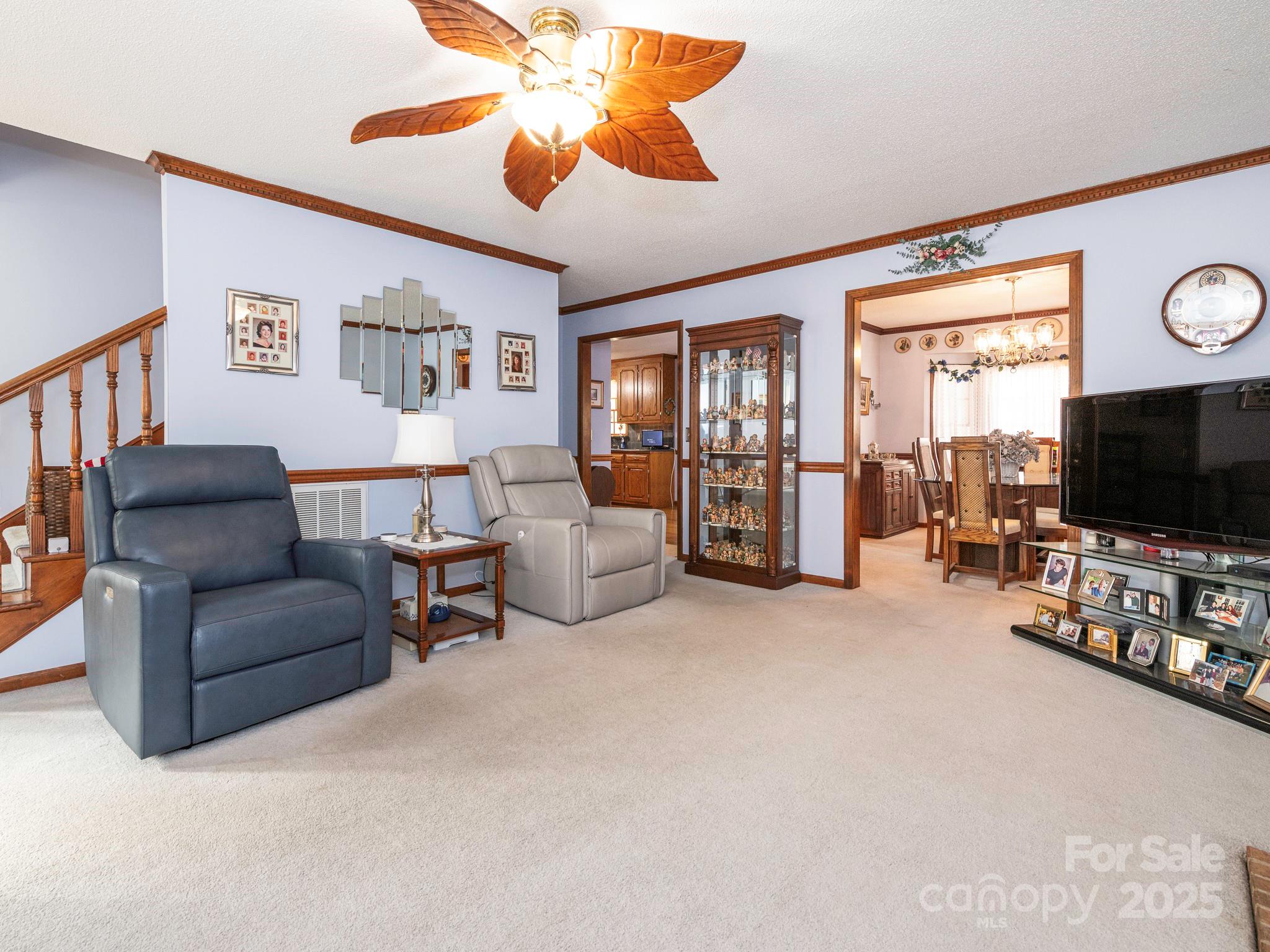 1800 Lake Lynn Road Concord, NC 28025 - Photo 6 of 45 a living room with furniture and a flat screen tv