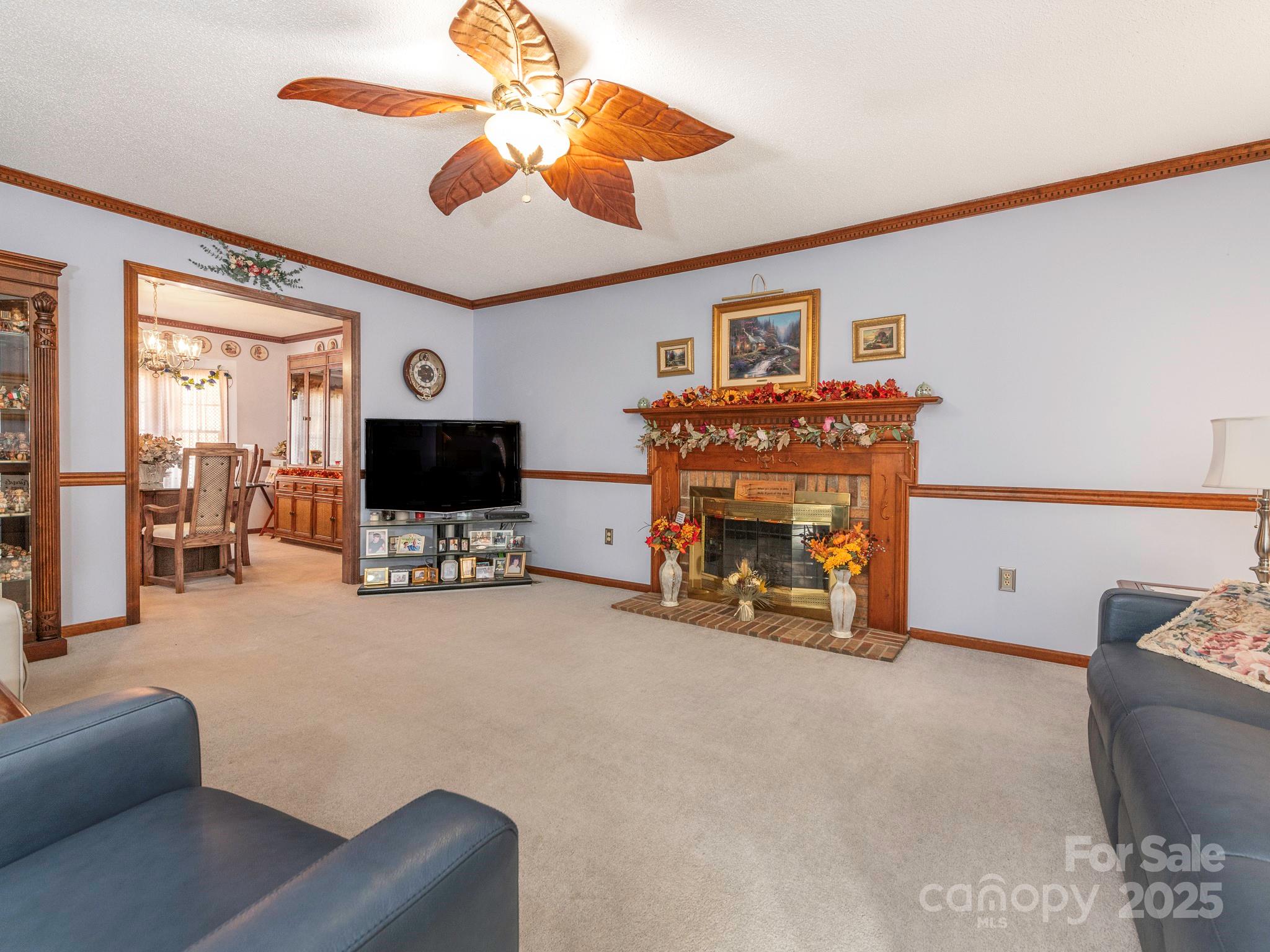 1800 Lake Lynn Road Concord, NC 28025 - Photo 7 of 45 a living room with furniture and a flat screen tv