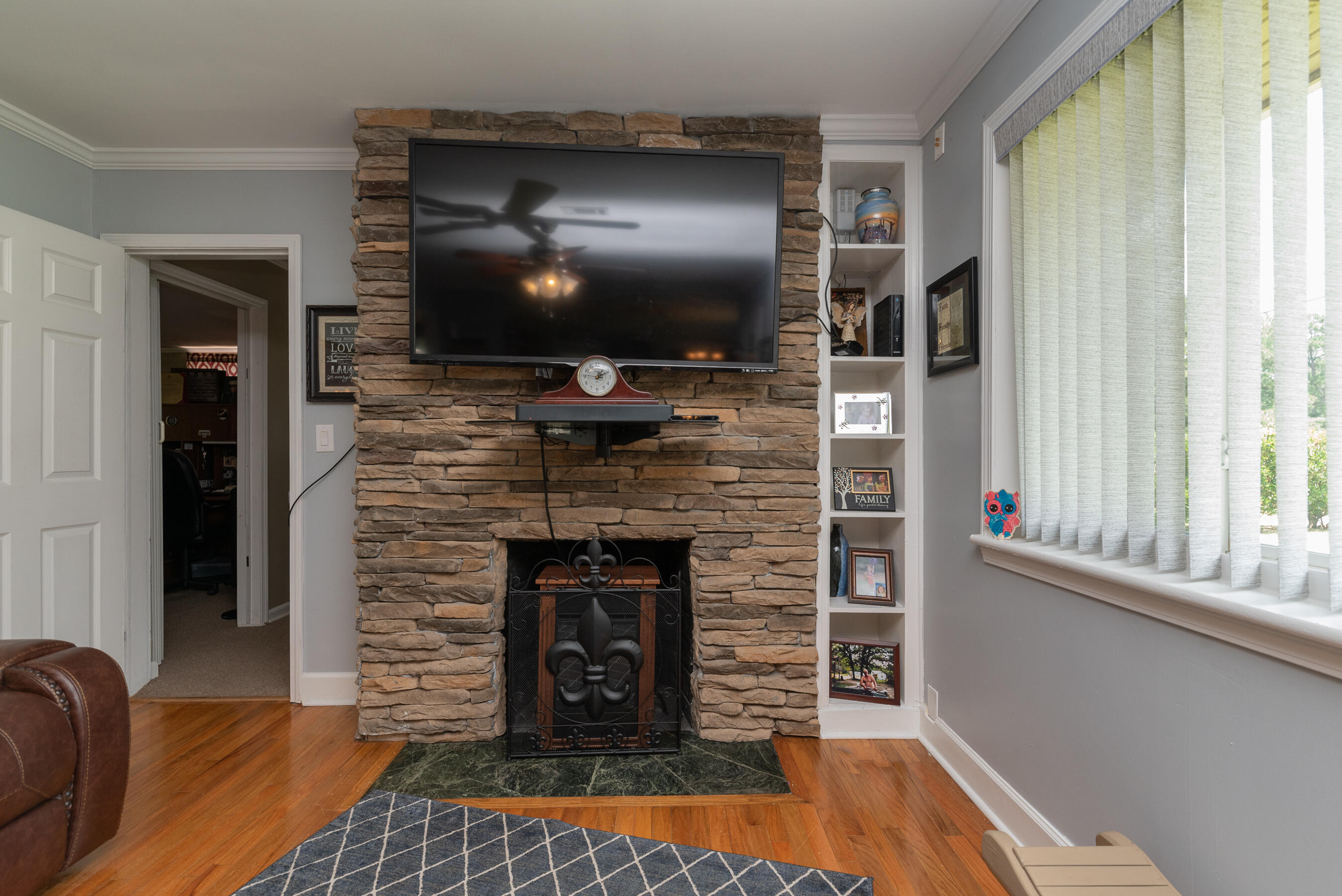 2005 Robin Road North Augusta, SC 29841 - Photo 7 of 36 a living room with a fireplace and a flat screen tv