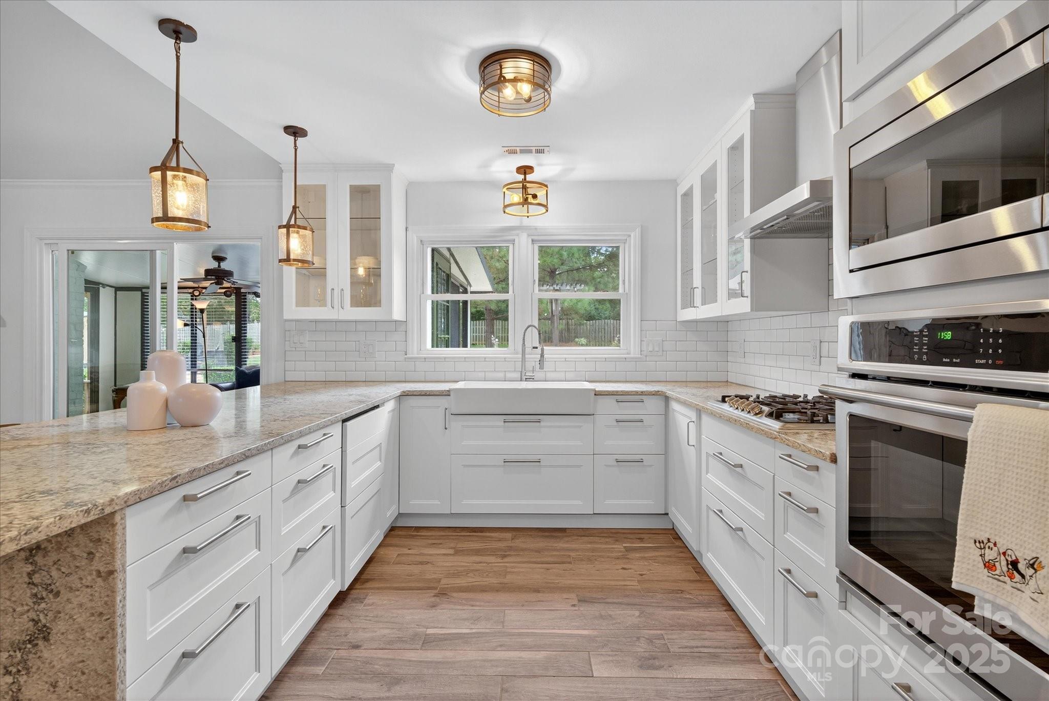 11710 Buckstone Lane Charlotte, NC 28277 - Photo 13 of 42 a kitchen with stainless steel appliances granite countertop a stove and a sink