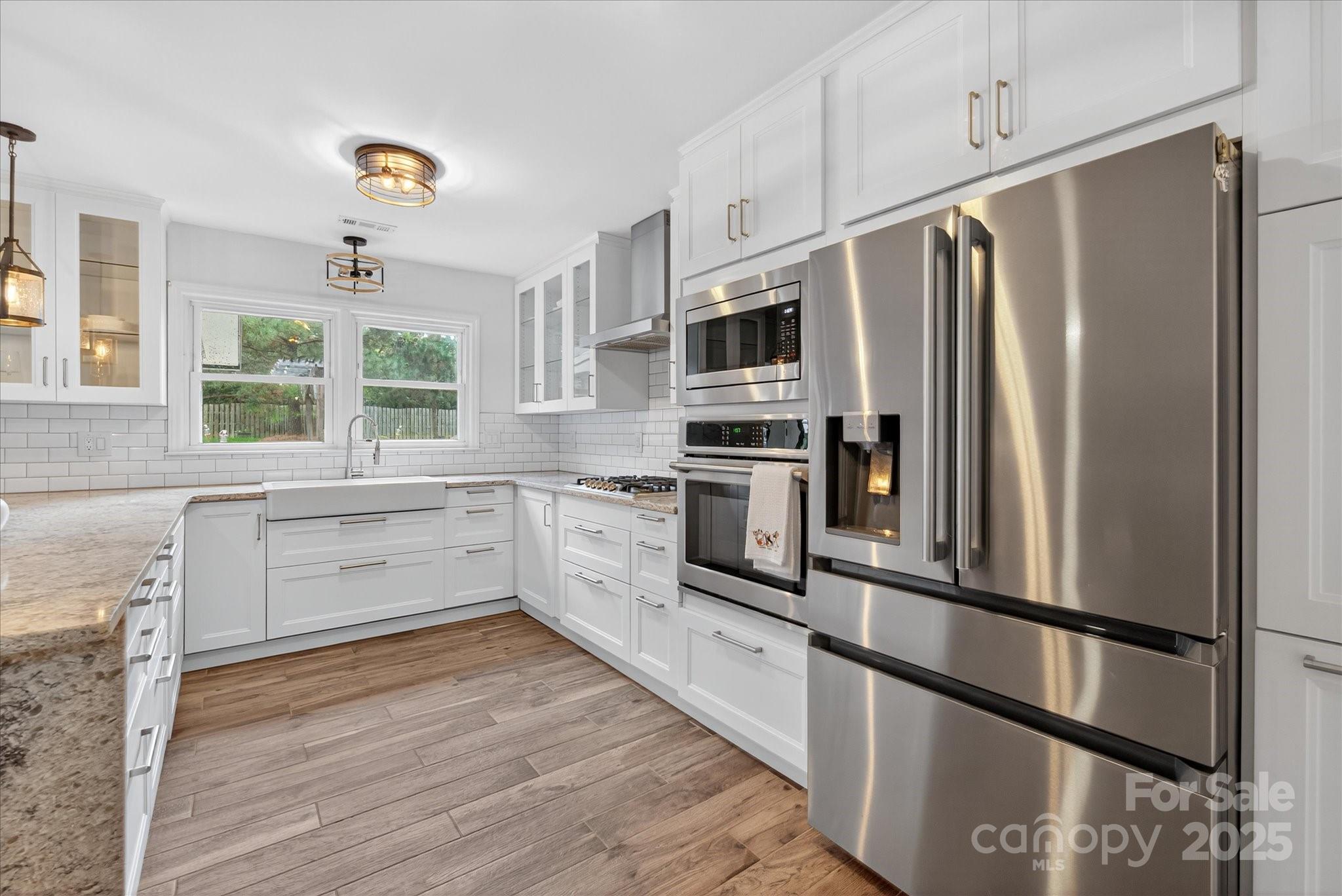 11710 Buckstone Lane Charlotte, NC 28277 - Photo 14 of 42 a kitchen with stainless steel appliances a refrigerator sink and microwave