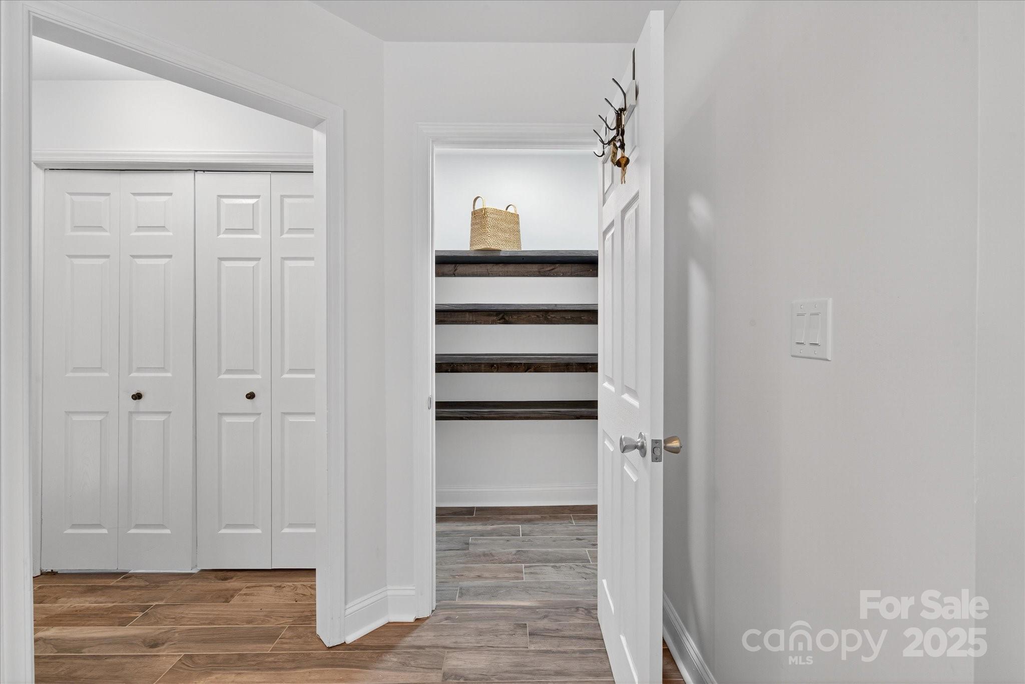 11710 Buckstone Lane Charlotte, NC 28277 - Photo 16 of 42 a view of a hallway with wooden floor and closet