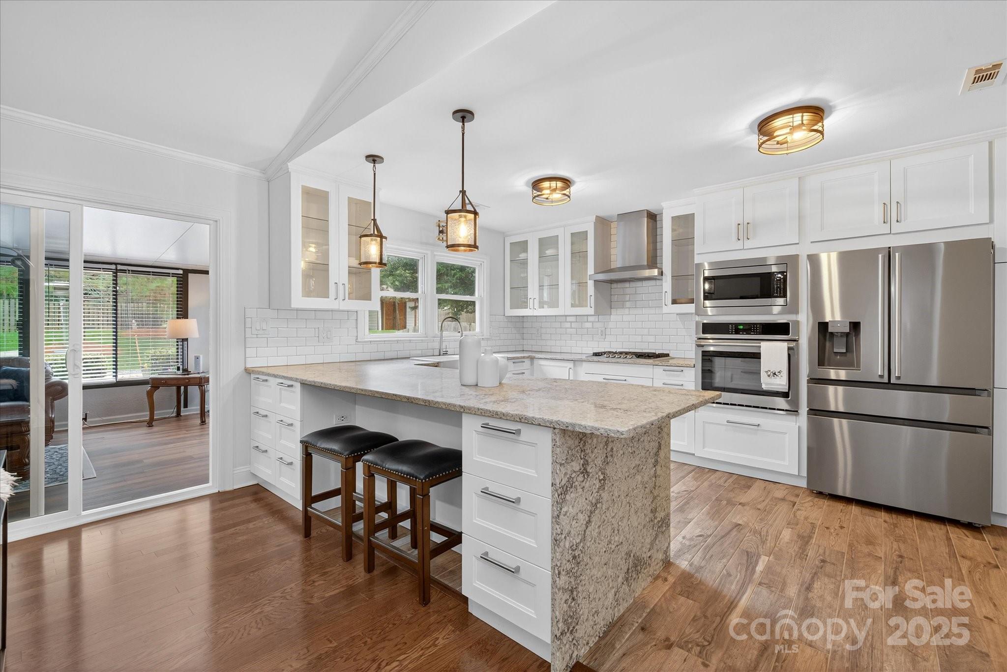 11710 Buckstone Lane Charlotte, NC 28277 - Photo 17 of 42 a kitchen with kitchen island a counter top space appliances and cabinets