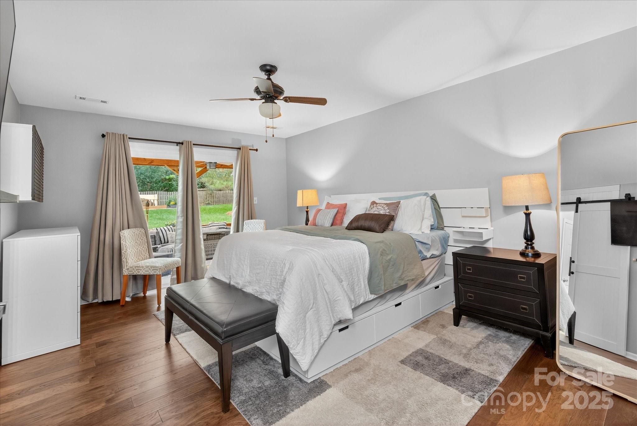 11710 Buckstone Lane Charlotte, NC 28277 - Photo 18 of 42 a spacious bedroom with a bed and wooden floor