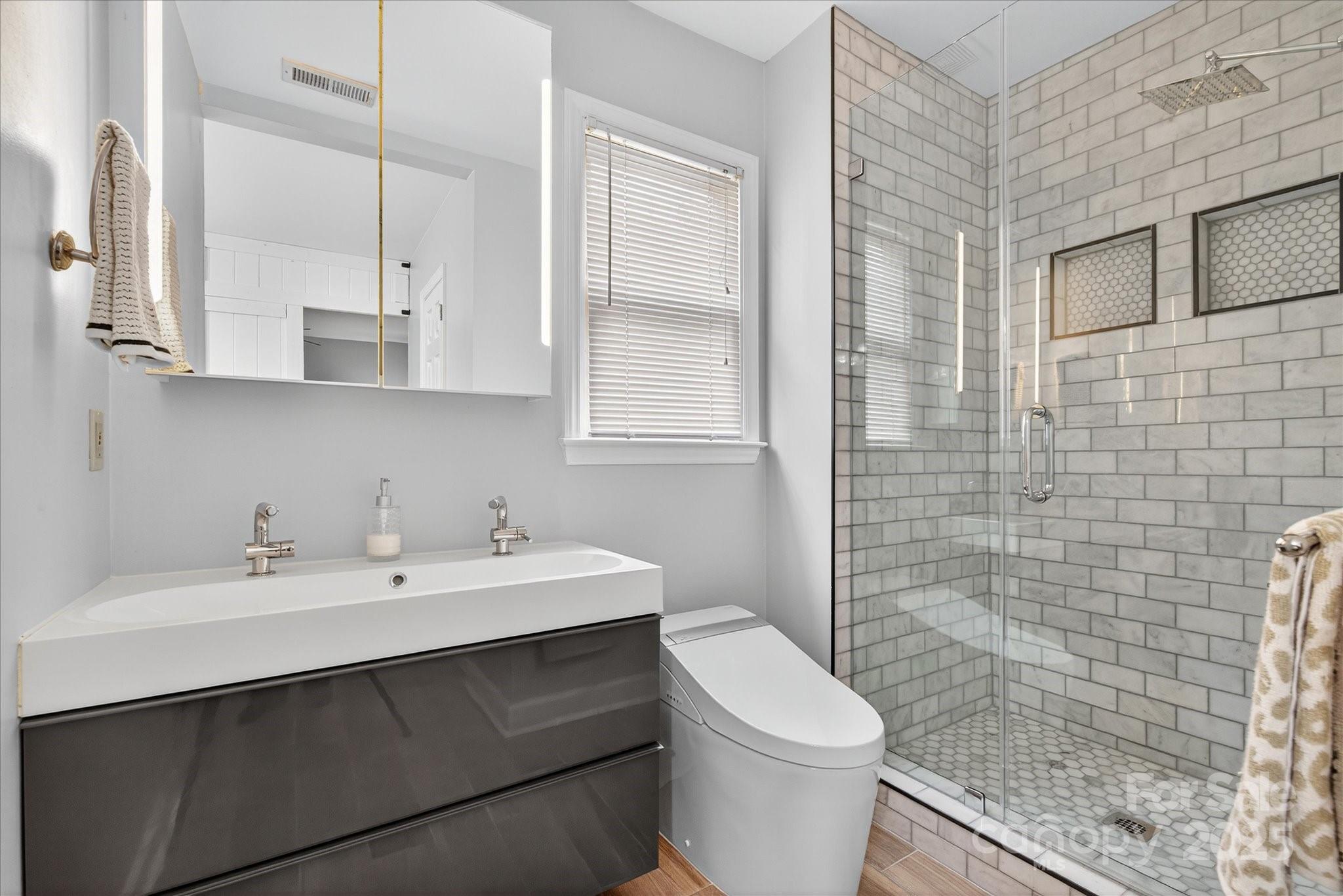 11710 Buckstone Lane Charlotte, NC 28277 - Photo 19 of 42 a bathroom with a sink a toilet and shower