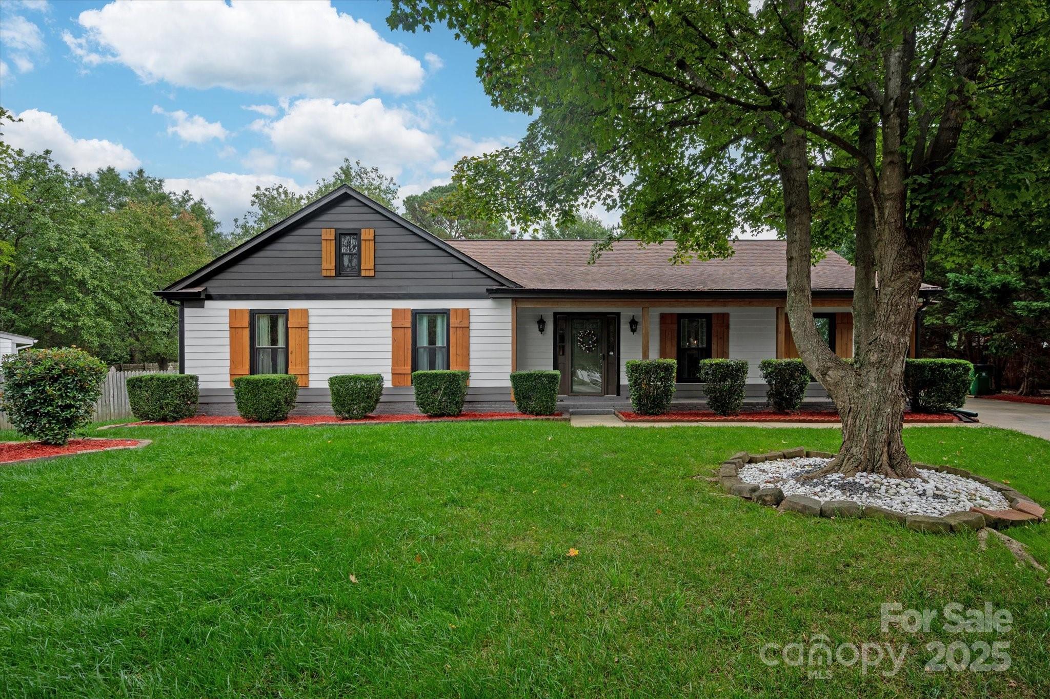 11710 Buckstone Lane Charlotte, NC 28277 - Photo 2 of 42 a front view of a house with a yard patio and green space