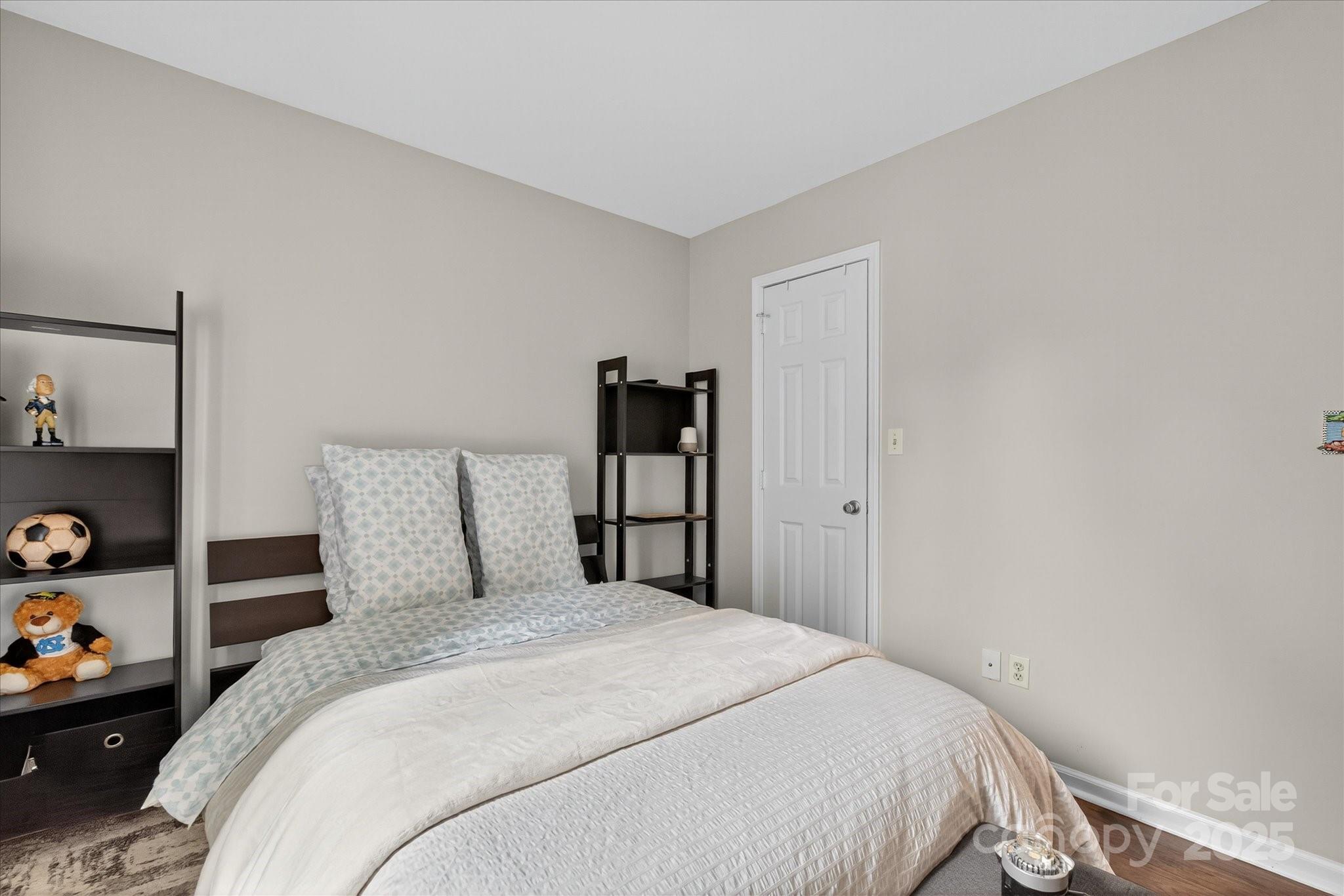 11710 Buckstone Lane Charlotte, NC 28277 - Photo 23 of 42 a bedroom with a bed and a closet