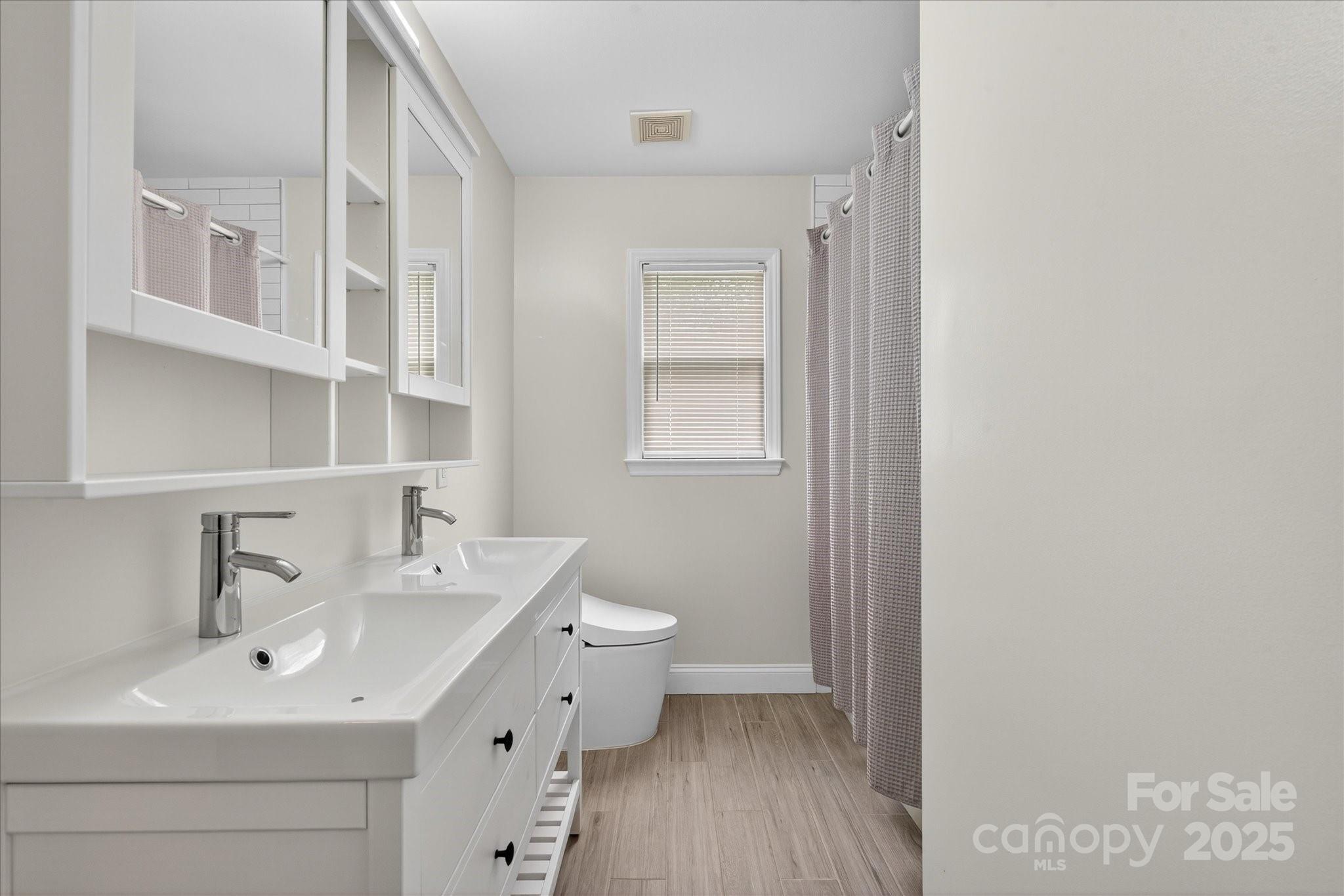 11710 Buckstone Lane Charlotte, NC 28277 - Photo 24 of 42 a bathroom with a sink mirror and toilet