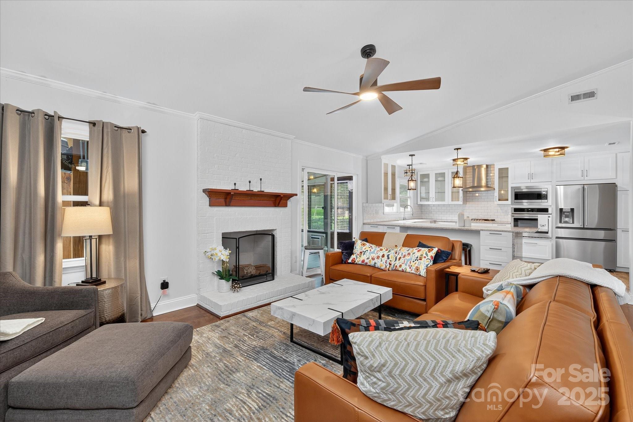 11710 Buckstone Lane Charlotte, NC 28277 - Photo 6 of 42 a living room with furniture and a fireplace