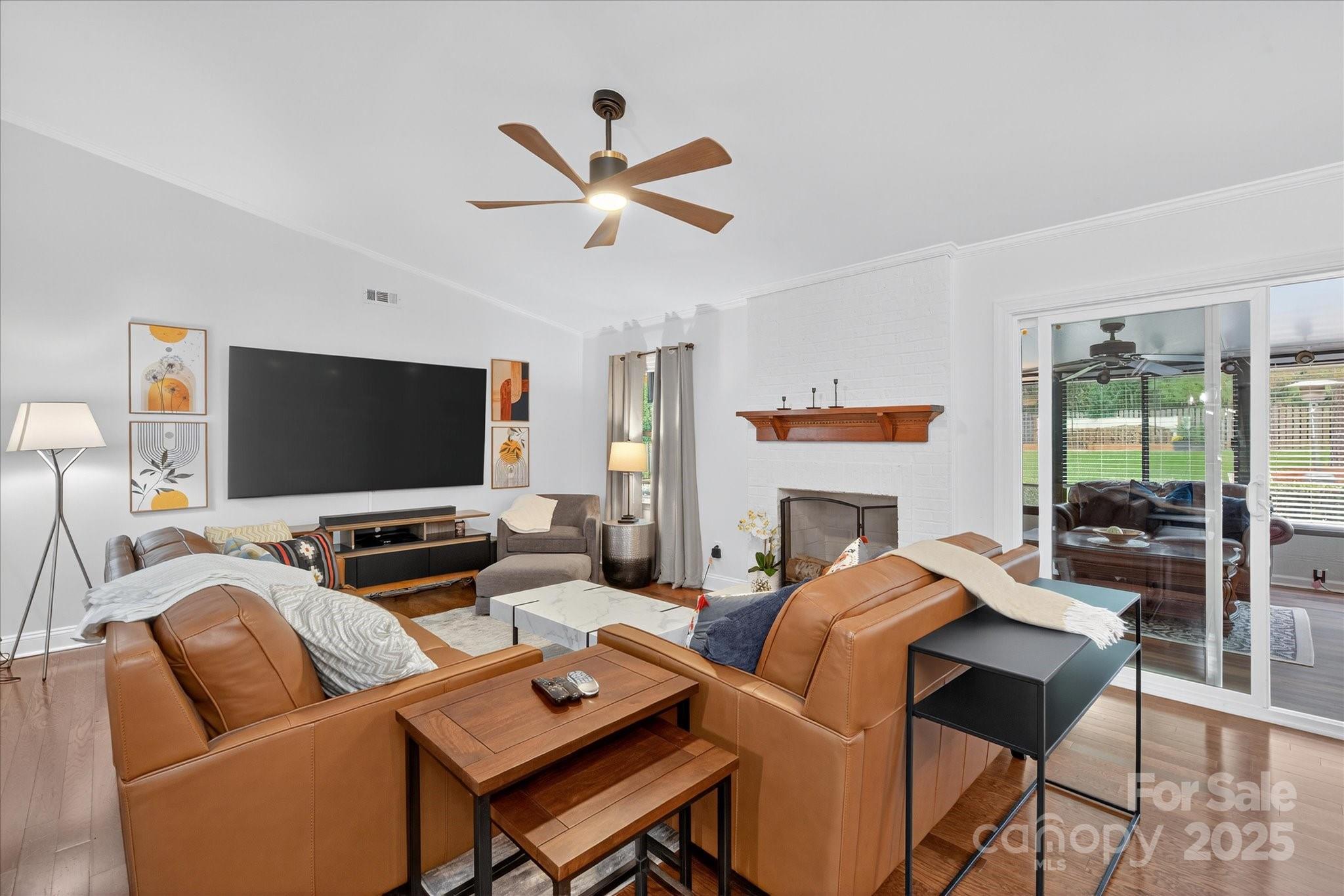11710 Buckstone Lane Charlotte, NC 28277 - Photo 7 of 42 a living room with fireplace furniture and a flat screen tv