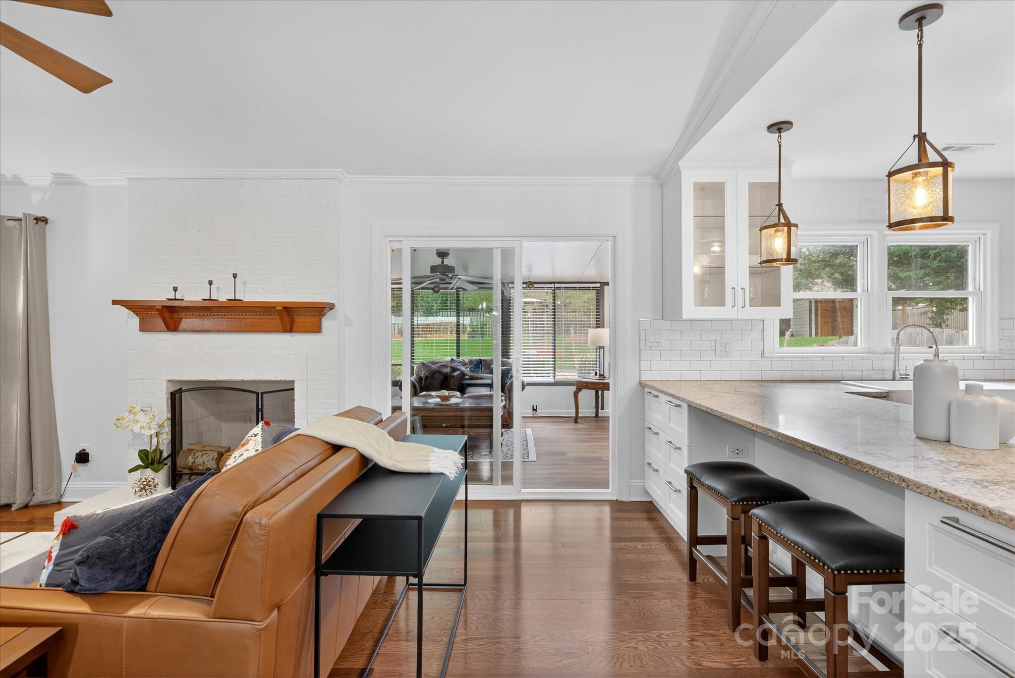 11710 Buckstone Lane Charlotte, NC 28277 - Photo 8 of 42 a living room with furniture a fireplace and wooden floor