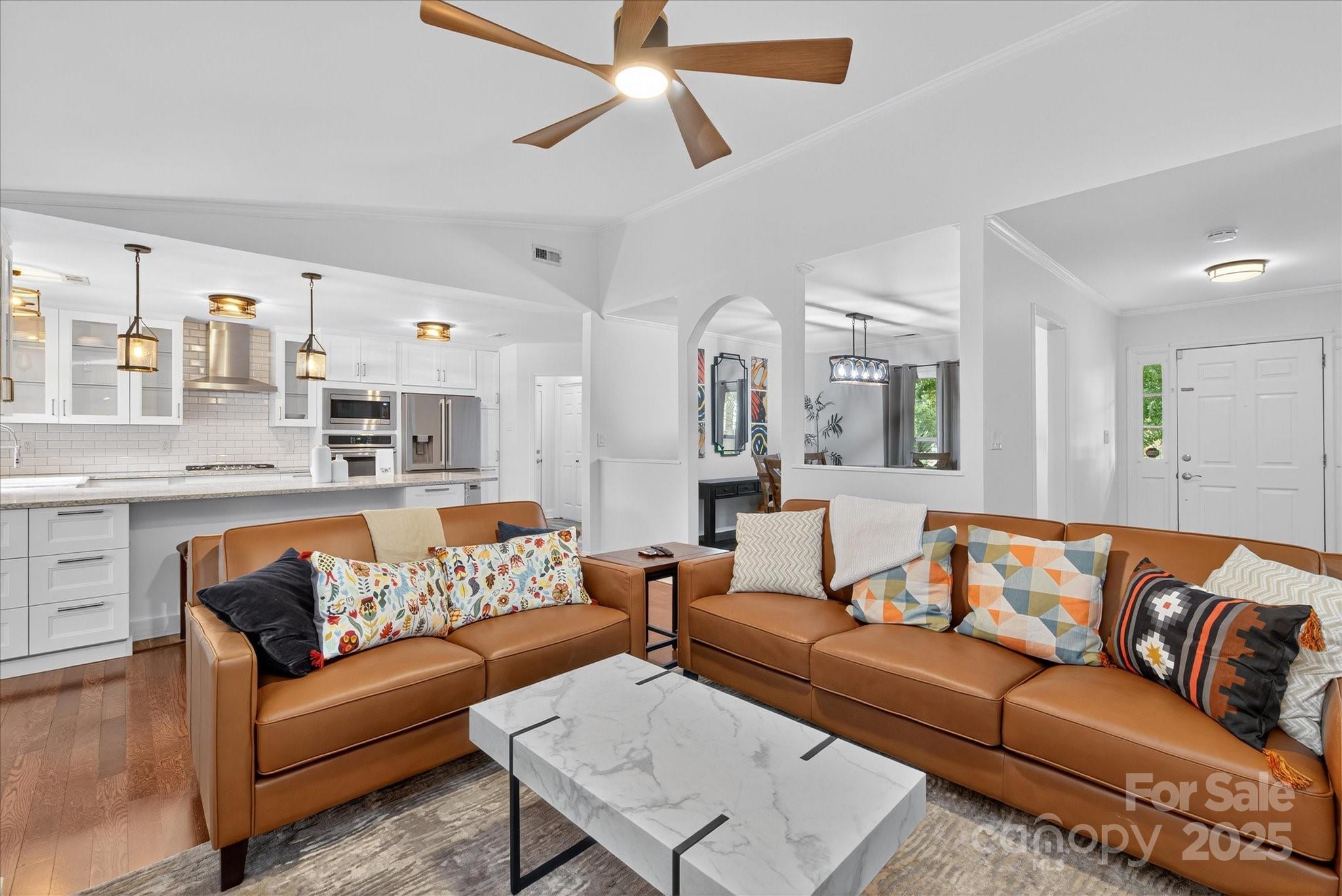 11710 Buckstone Lane Charlotte, NC 28277 - Photo 10 of 42 a view of living room kitchen with furniture and a ceiling fan