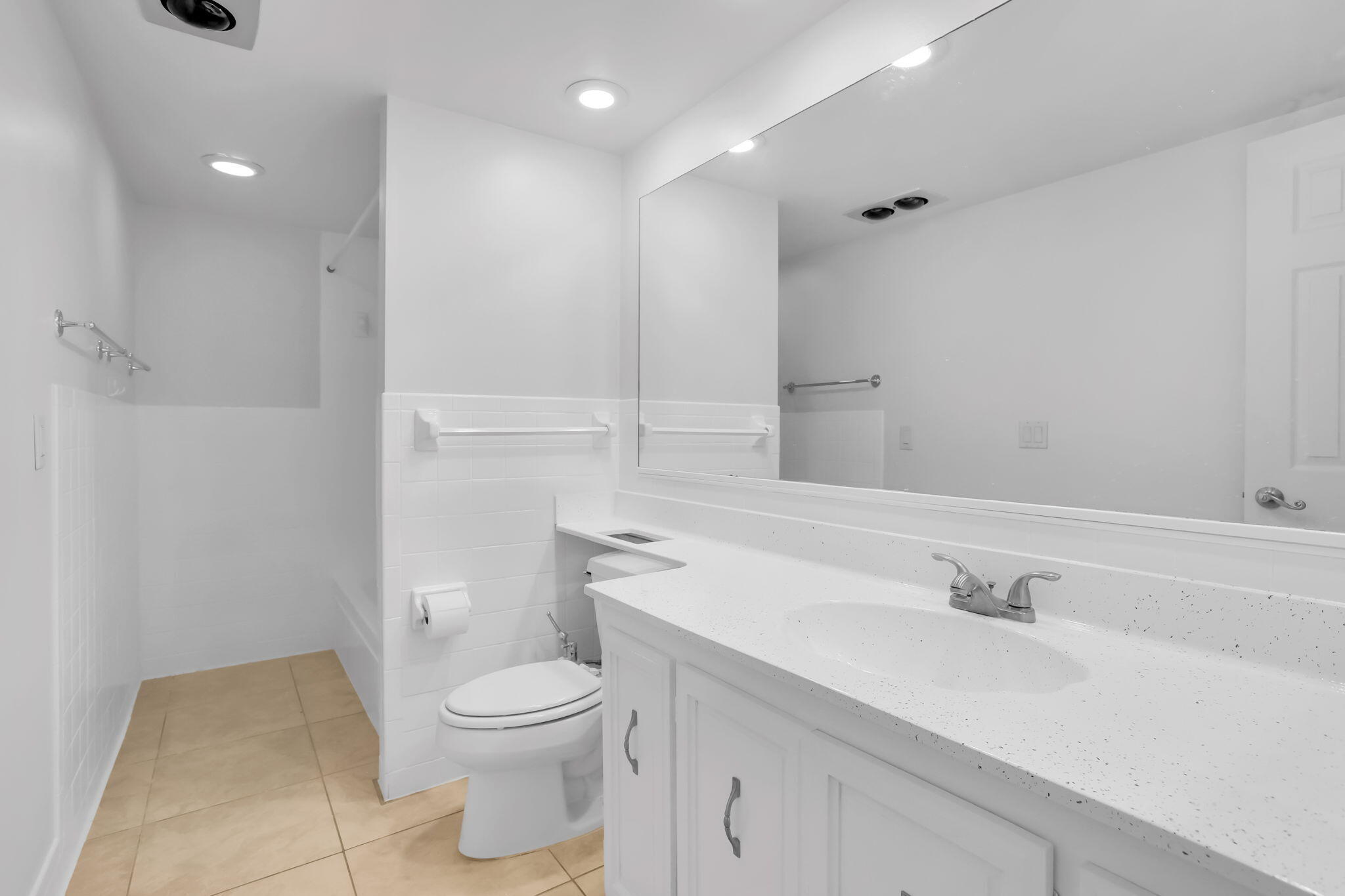 89 Lariat Circle Boca Raton, FL 33487 - Photo 14 of 31 a bathroom with a sink a toilet and a mirror