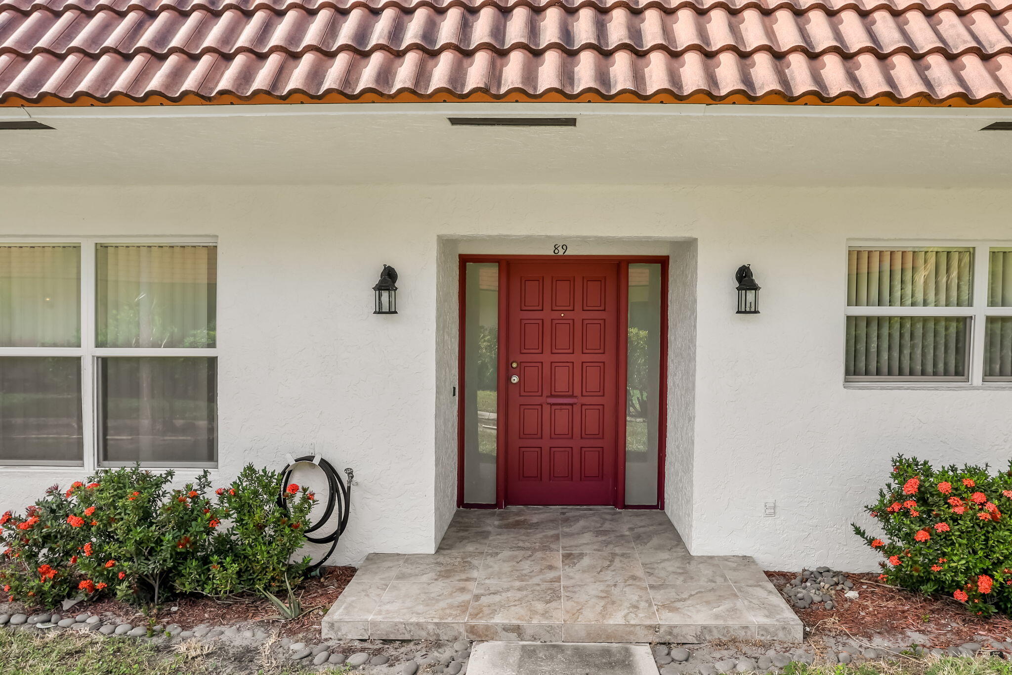 89 Lariat Circle Boca Raton, FL 33487 - Photo 2 of 31 a front view of a house with entryway
