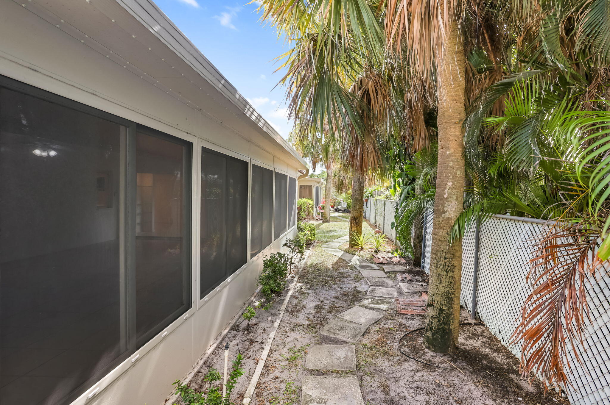 89 Lariat Circle Boca Raton, FL 33487 - Photo 29 of 31 a view of a backyard with palm trees
