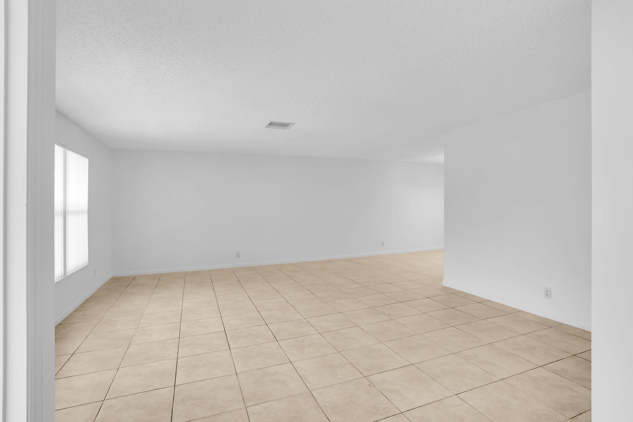 89 Lariat Circle Boca Raton, FL 33487 - Photo 3 of 31 an empty room with a natural light