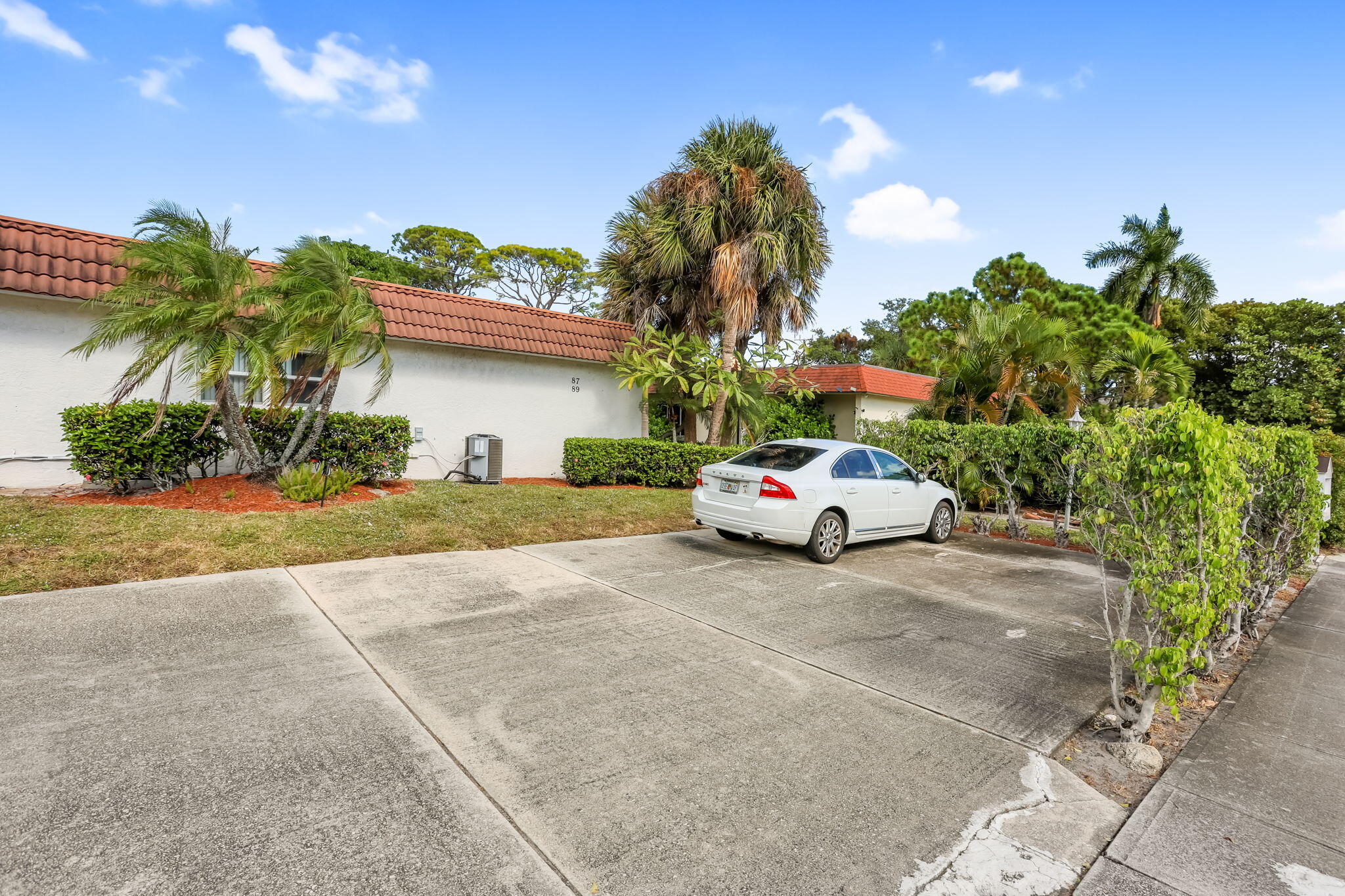 89 Lariat Circle Boca Raton, FL 33487 - Photo 31 of 31 a view of a car parked in front of a house
