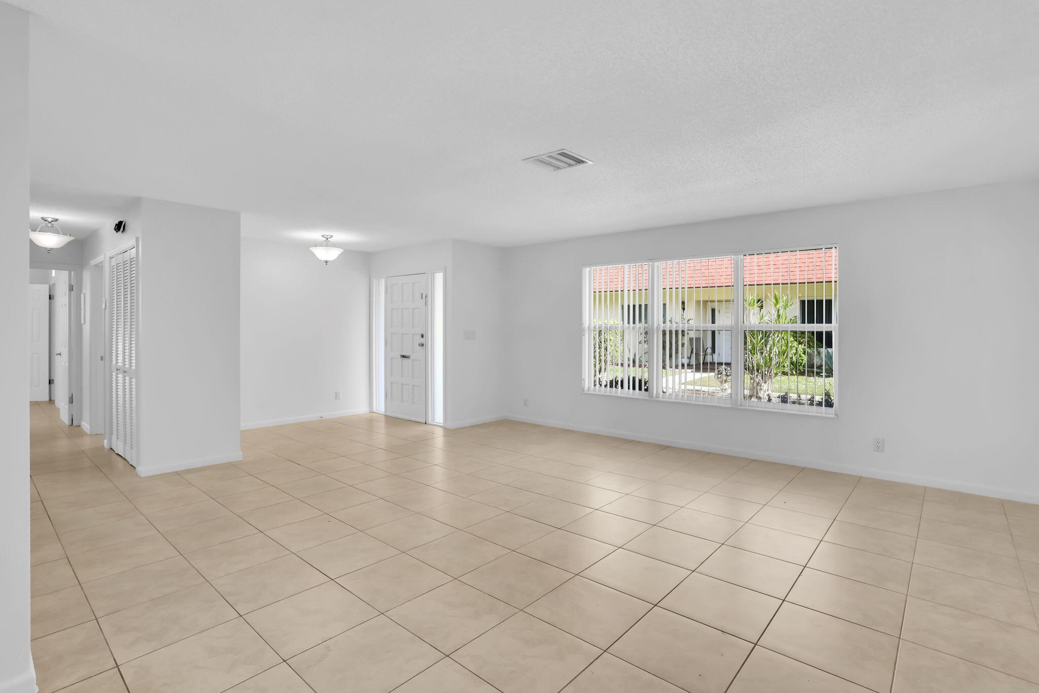 89 Lariat Circle Boca Raton, FL 33487 - Photo 5 of 31 a view of an empty room with a window