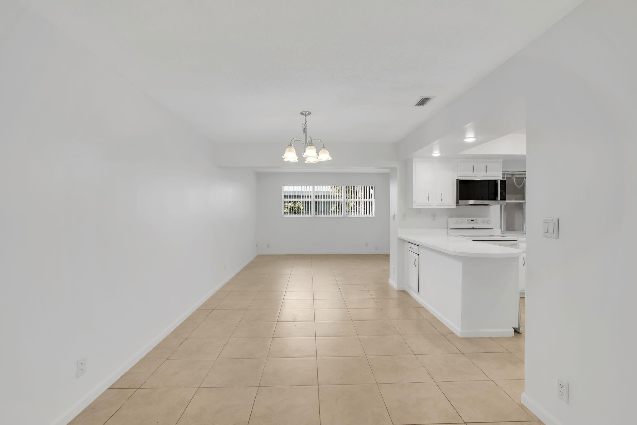 89 Lariat Circle Boca Raton, FL 33487 - Photo 7 of 31 a view of an empty room with a window