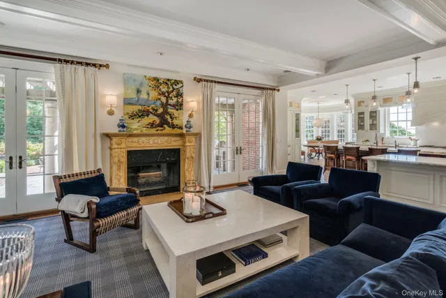 a living room with furniture flat screen tv and a fireplace