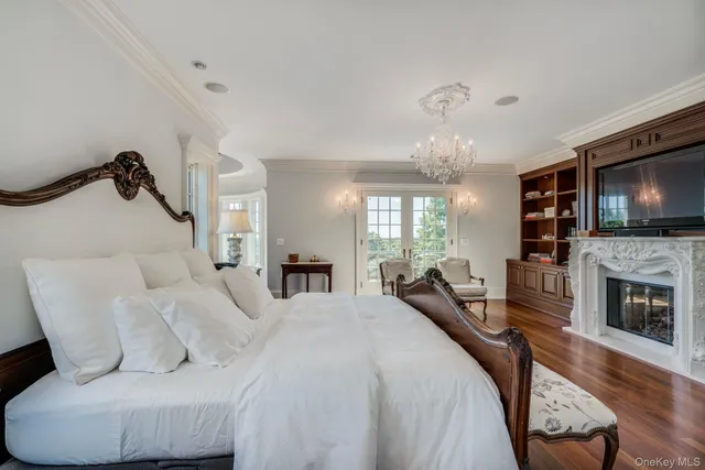 a bedroom with furniture and wooden floor